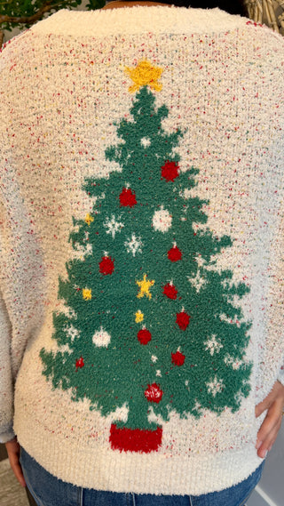 Sweater with a Christmas tree design on a textured background