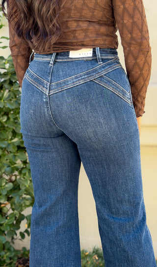 Close-up back view of Risen wide leg jeans showing the stretchy V yoke stitching and high rise waistband