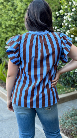 Back view of the Entro brown and blue striped ruffle sleeve blouse.