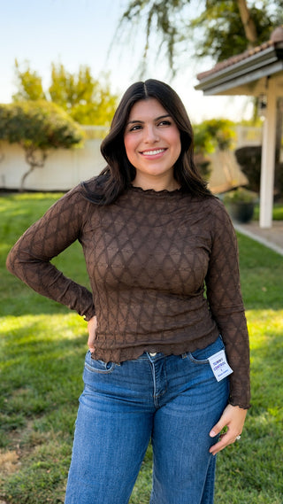 Women's brown textured long sleeve layering top styled with blue jeans