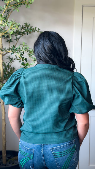 Women's green textured V-neck puff sleeve top with short sleeves