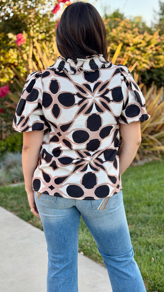 Back view of the Entro geometric print puff sleeve blouse.