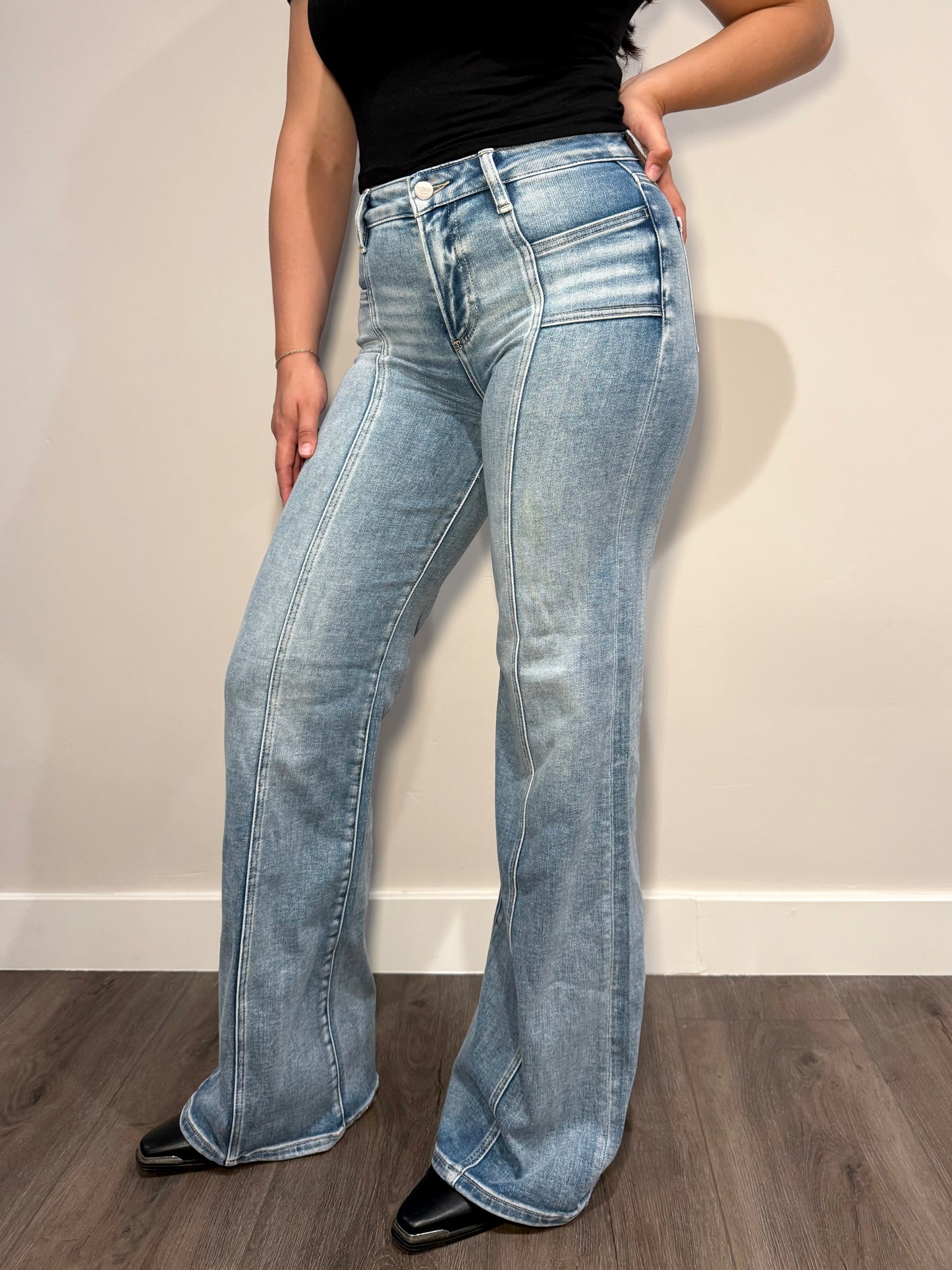 Women's light wash mid rise jeans with seam down the middle