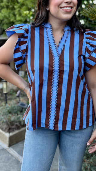 Detail of the ruffle sleeve on the Entro brown and blue striped blouse.