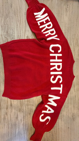 Red crop top with 'MERRY CHRISTMAS' text on a wooden surface