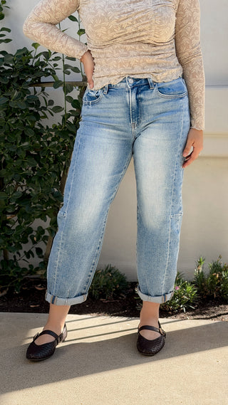 Risen high rise barrel jeans in stretch light wash denim with cuffed hem, front view styled with black flats