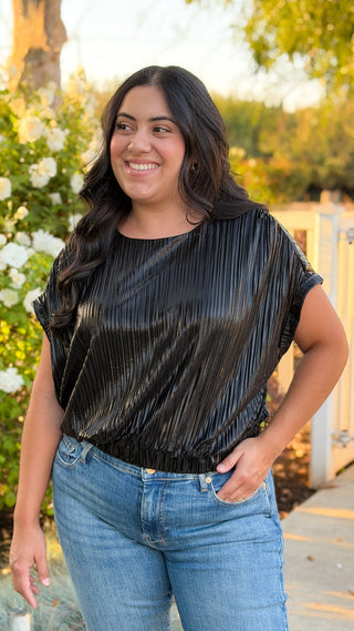 Women's black pleated drop shoulder top with elastic waistband