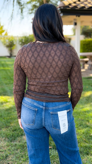 Women's brown textured long sleeve layering top styled with blue jeans