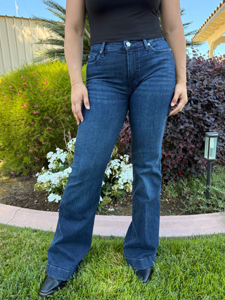 Dark blue jeans with studded detailing on the back pocket