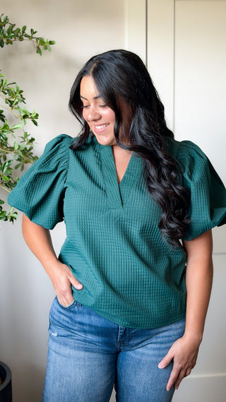 Women's green textured V-neck puff sleeve top with short sleeves
